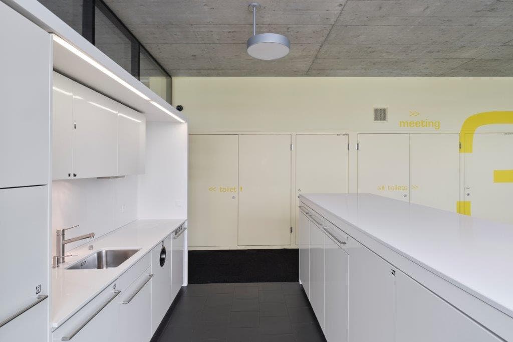View of a labarotary in the building WKL-132 in the Klybeck site in Basel with white work stations