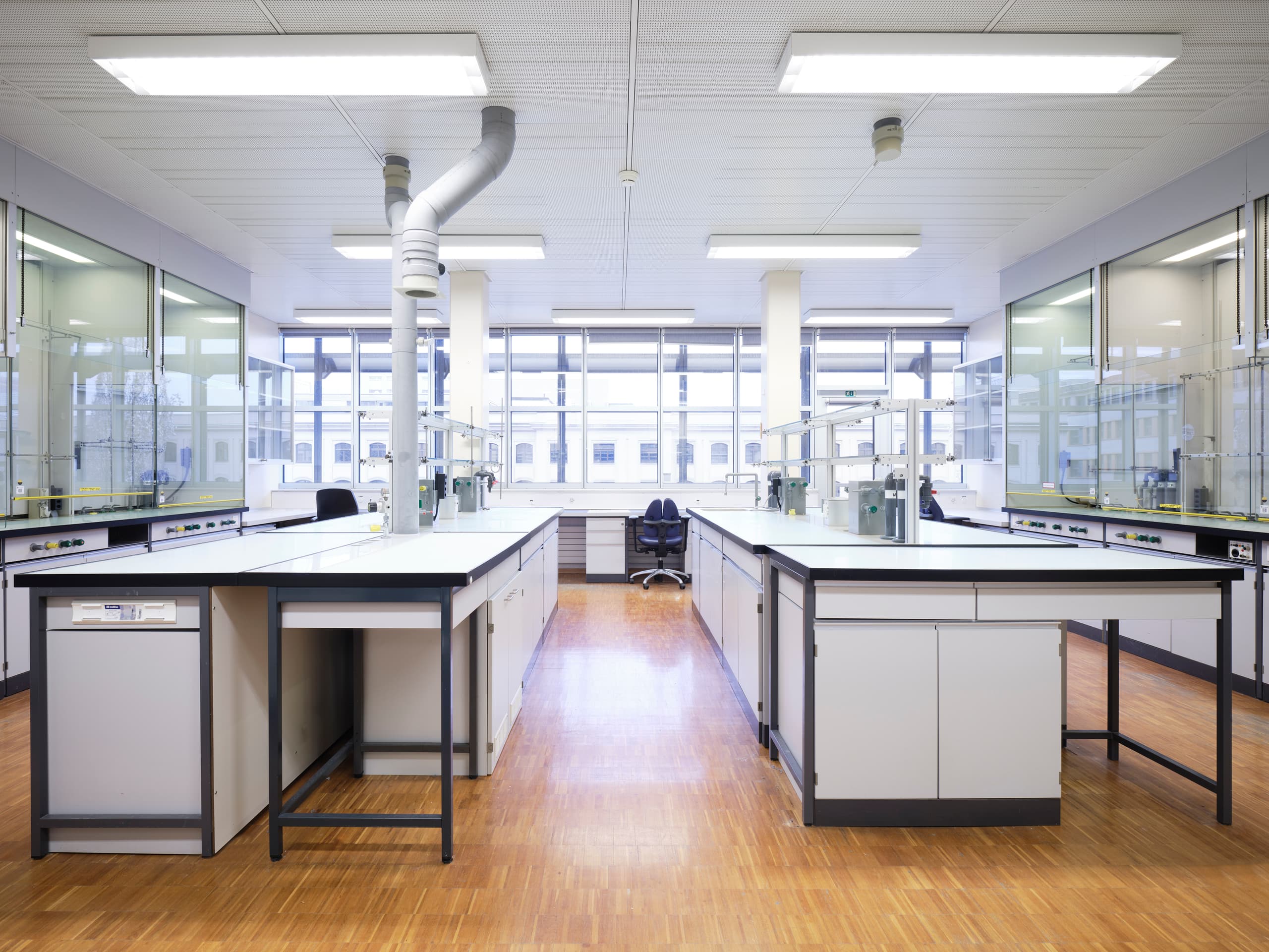 View of a labarotary in the building WKL-136 in the Klybeck site in Basel with working stations on each side of a corridor